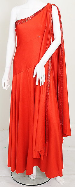 Appraisal: A red silk jersey dress and red beaded headress worn