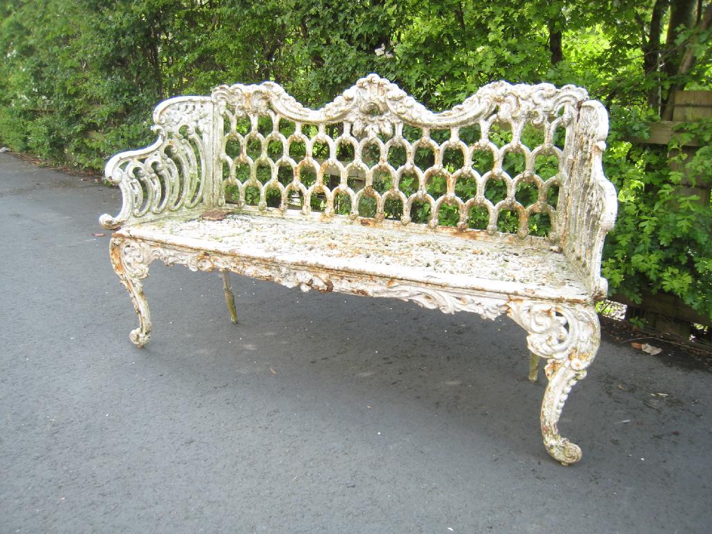 Appraisal: A th Century cast iron Garden Bench with scrolled and