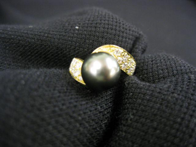 Appraisal: South Seas Black Pearl Diamond Ring mm pearl surrounded by