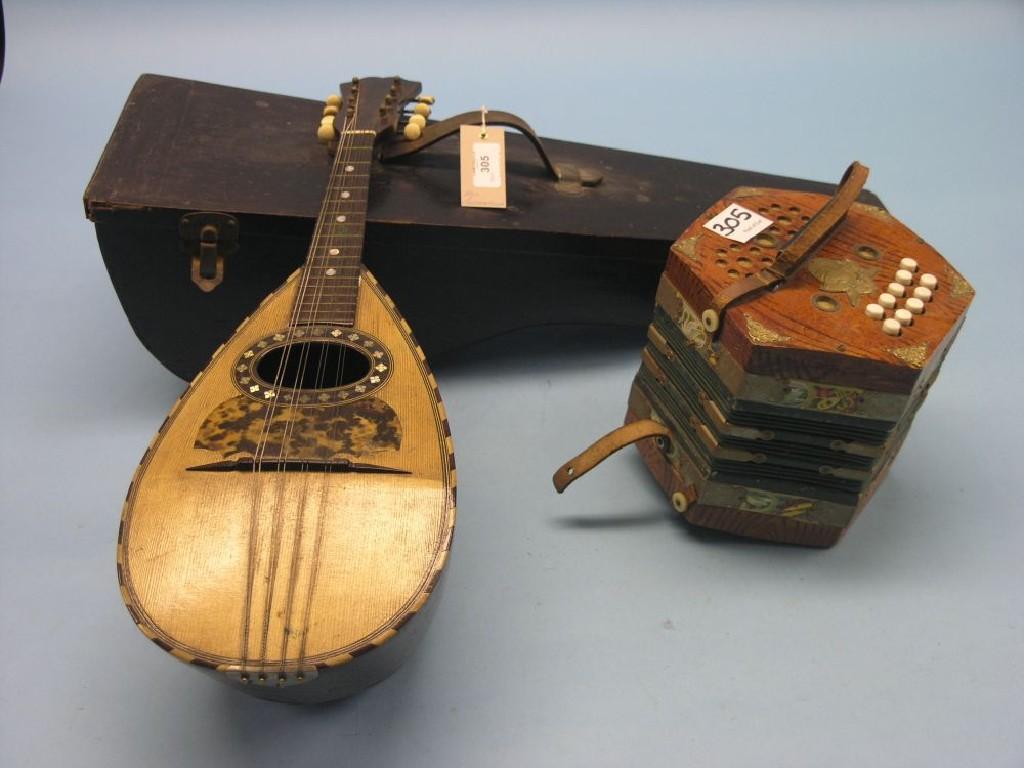 Appraisal: An Araldo concertina and an Italian mandolin cased