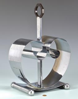 Appraisal: Mid-century modern chrome magazine rack designed by Fred Farr scroll