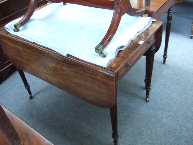 Appraisal: A Regency mahogany Pembroke table with single end frieze drawer