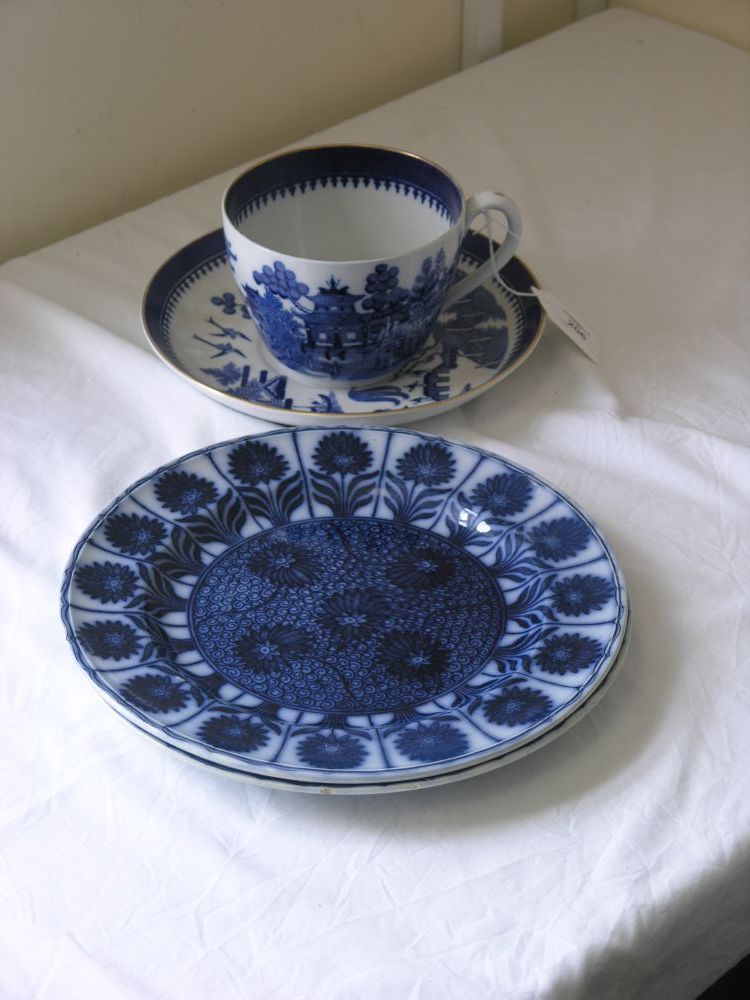 Appraisal: An oversize Minton's cup and saucer printed with Willow pattern