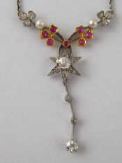 Appraisal: An antique gold and platinum ruby and diamond pendant necklace