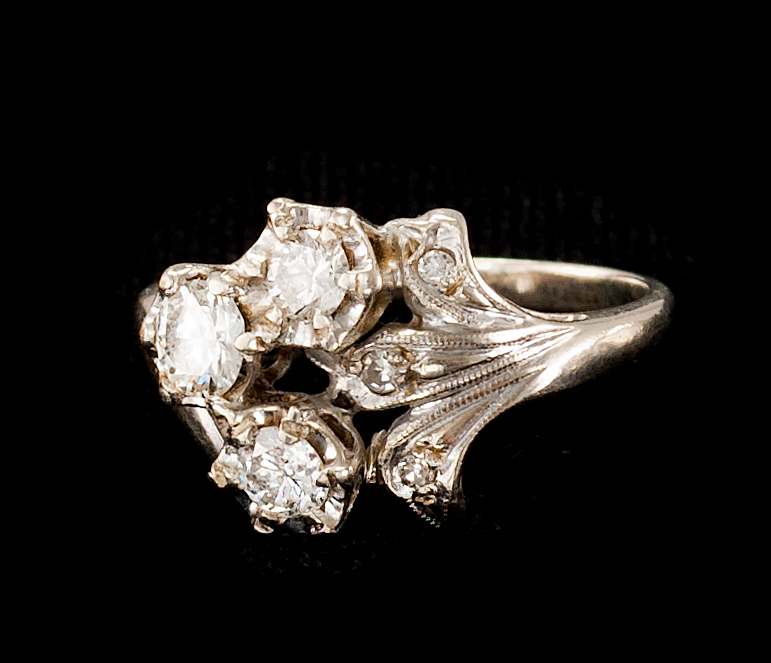 Appraisal: KT WHITE GOLD AND DIAMOND RING With three approximately carat