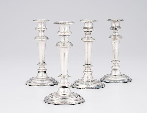 Appraisal: OLD SHEFFIELD PLATE CANDLESTICKS English ca Four Old Sheffield plate