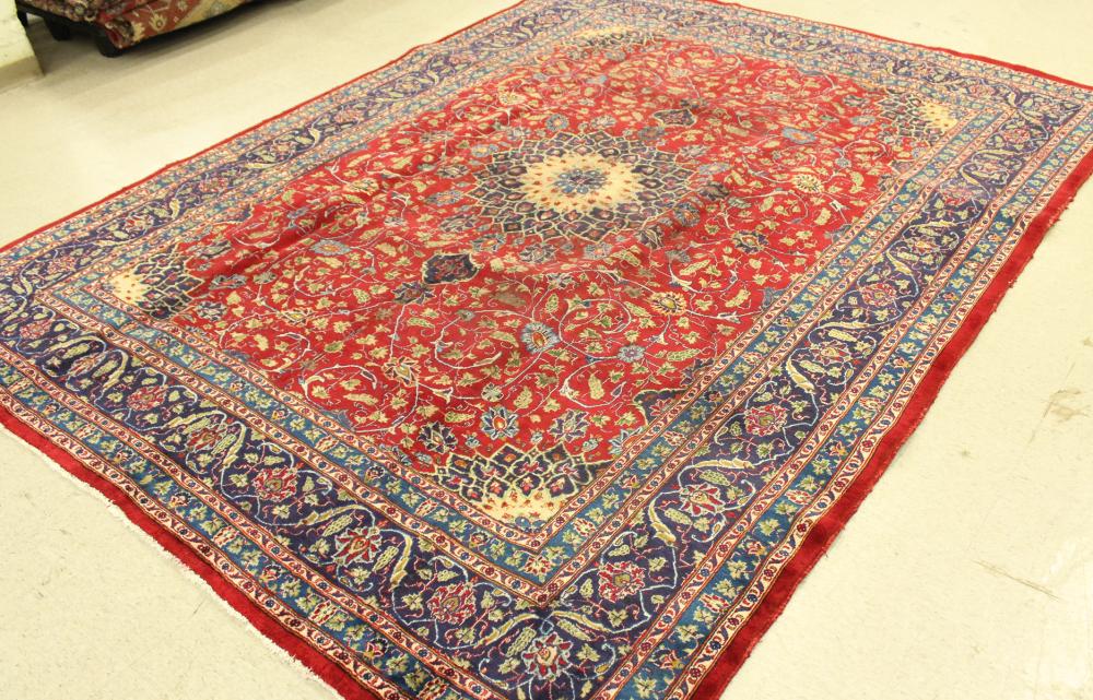 Appraisal: HAND KNOTTED PERSIAN CARPET floral and central floral medallion design