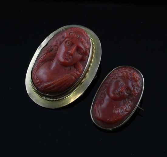 Appraisal: A Victorian gold mounted coral cameo brooch ins and another