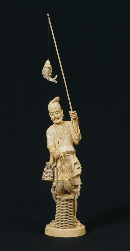 Appraisal: LARGE CARVED IVORY FISHERMAN Well carved figure of a man