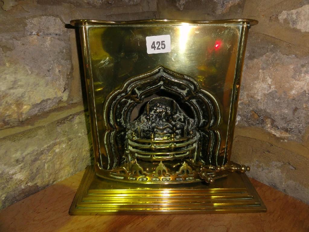 Appraisal: A brass th century miniature of a shaped fire surround