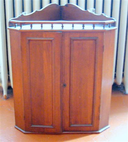 Appraisal: George III style mahogany hanging corner cupboard H in W