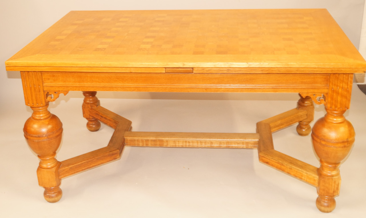 Appraisal: A light oak draw leaf dining table in Jacobean style