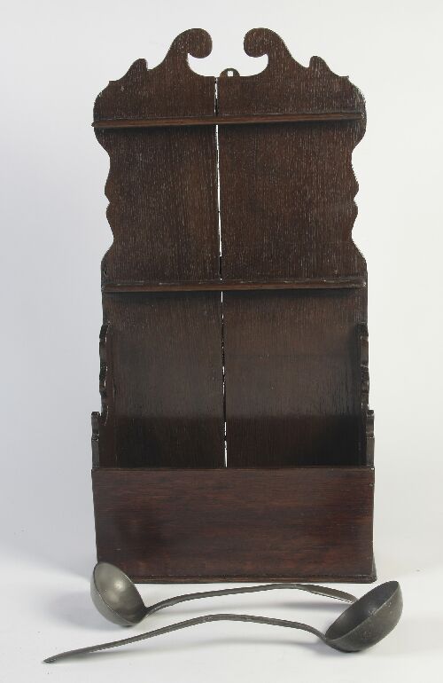 Appraisal: A Georgian style oak hanging spoon rack of two tiers