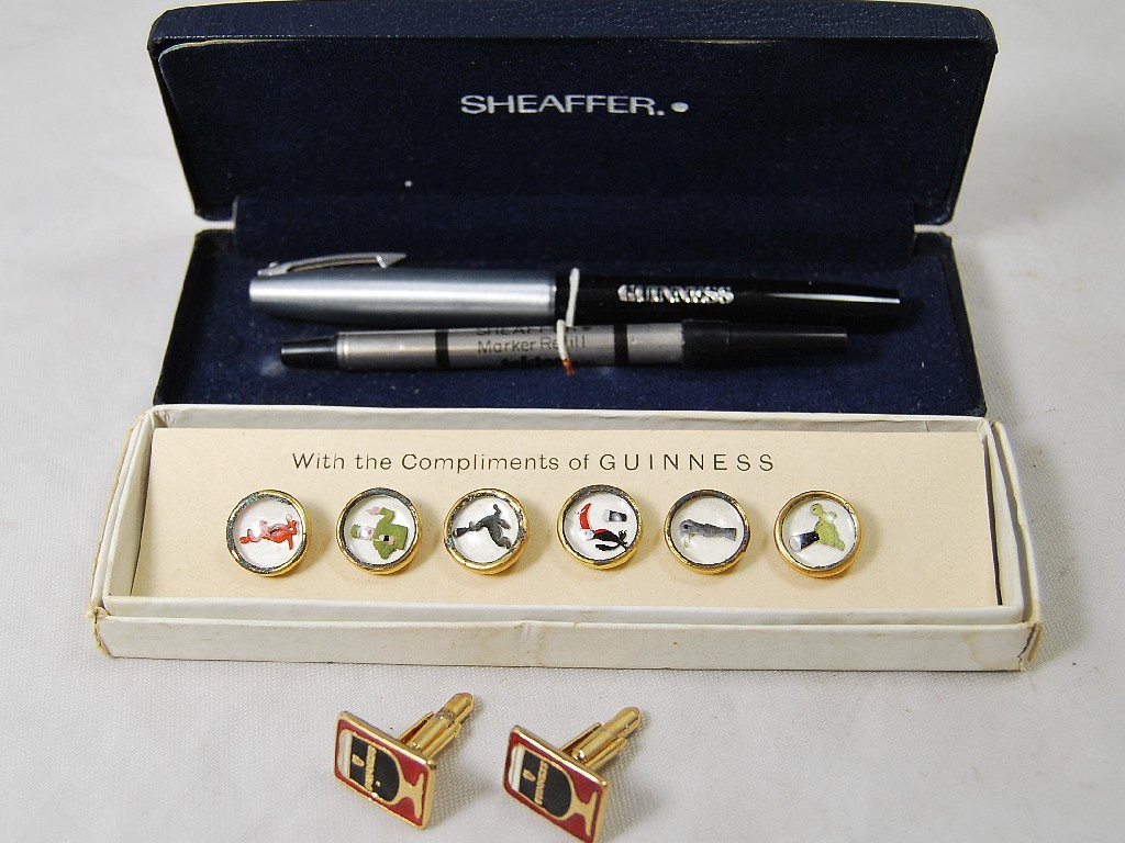 Appraisal: A boxed set of Guinness dress buttons featuring Guinness zoo