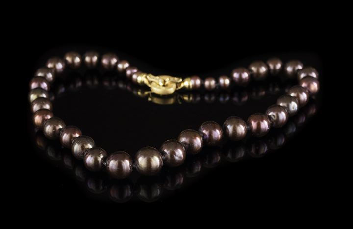 Appraisal: Unusual Strand of Cocoa-Colored Cultured Pearls of spherical shape ranging