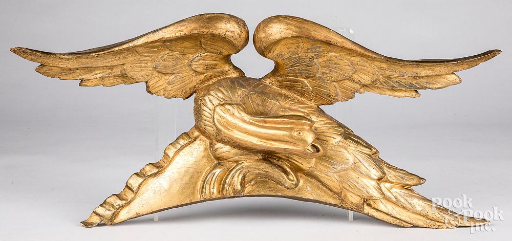 Appraisal: Giltwood spread winged eagle crest th c Giltwood spread winged