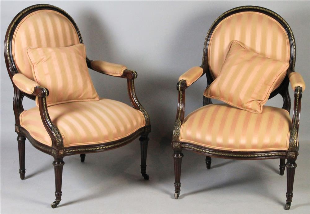 Appraisal: PAIR OF LOUIS XVI STYLE EBONY AND GILT FAUTEUILS each