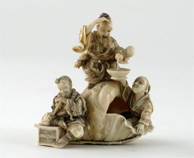 Appraisal: A Japanese ivory group carved as three men and a