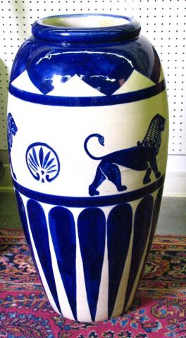 Appraisal: Pottery jardiniere blue glaze over beige ground lion motif decoration