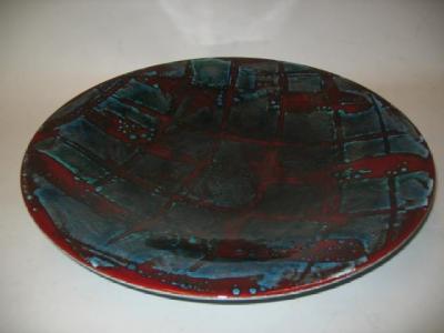 Appraisal: A POOLE POTTERY CHARGER designed by Sally Tuffin with an