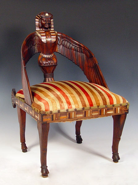 Appraisal: INLAID EGYPTIAN REVIVAL CARVED MAHOGANY CHAIR Featuring a winged figure