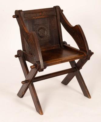 Appraisal: A th Century carved oak Glastonbury chair on X-frame supports