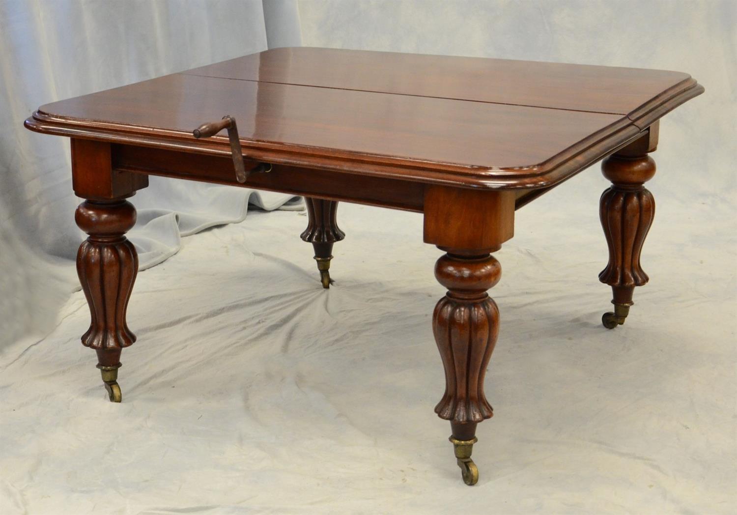 Appraisal: English Victorian mahogany extension dining table with crank operated screw