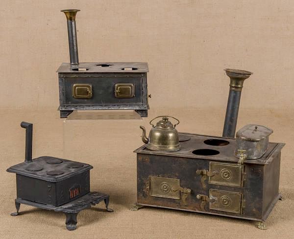 Appraisal: Three tin toy stoves to include a Phoenix Three tin