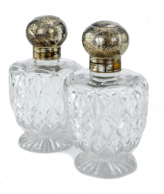 Appraisal: A PAIR OF VICTORIAN SILVER-MOUNTED CUT GLASS SCENT BOTTLES of