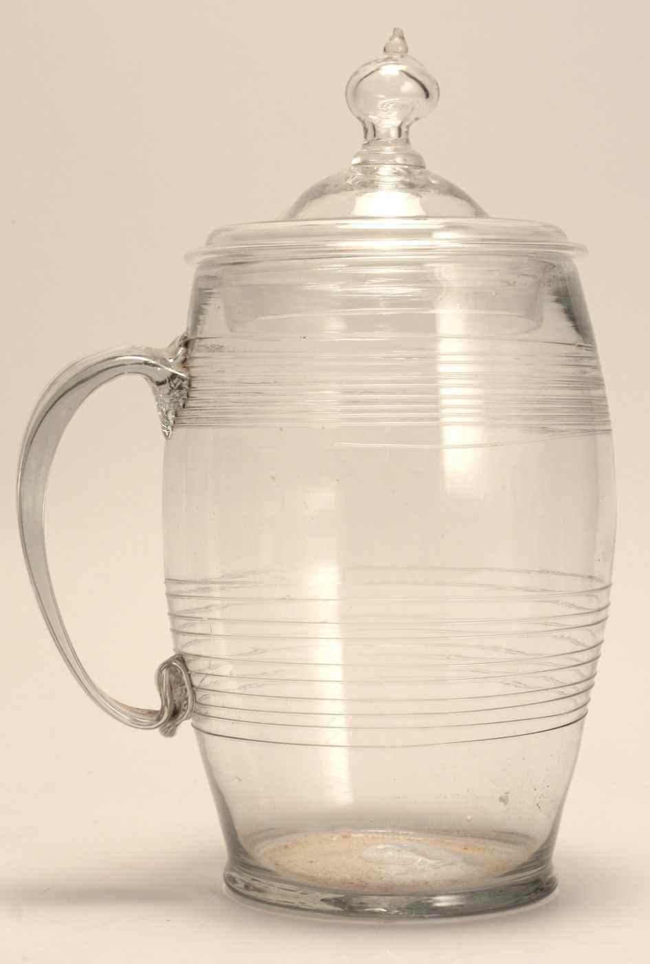 Appraisal: BLOWN GLASS LIDDED DRINKING MUG th CenturyWith strap handle Applied