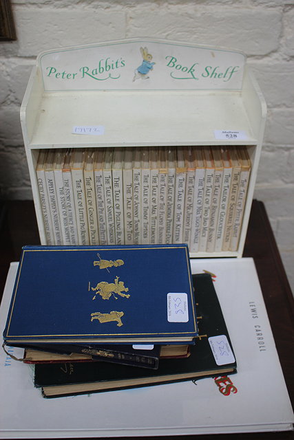 Appraisal: A SET OF BEATRIX POTTER BOOKS mounted in a little