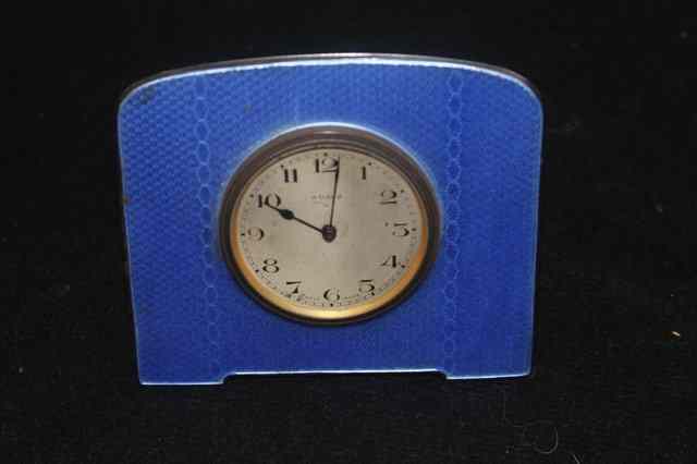 Appraisal: AN ENAMELLED DESK WATCH stylised form with blue decoration containing