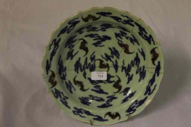 Appraisal: A CHINESE CELADON CIRCULAR DISH decorated with bats in iron