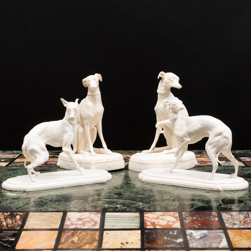 Appraisal: Two Pairs of Continental Biscuit Porcelain Models of Whippets Comprising