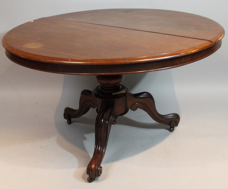 Appraisal: A Victorian mahogany supper table the circular moulded top raised