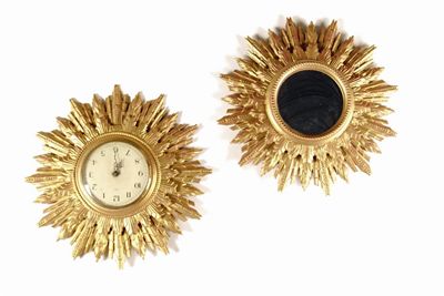 Appraisal: A gilt sunburst clock and a matching convex mirror 'Gomme