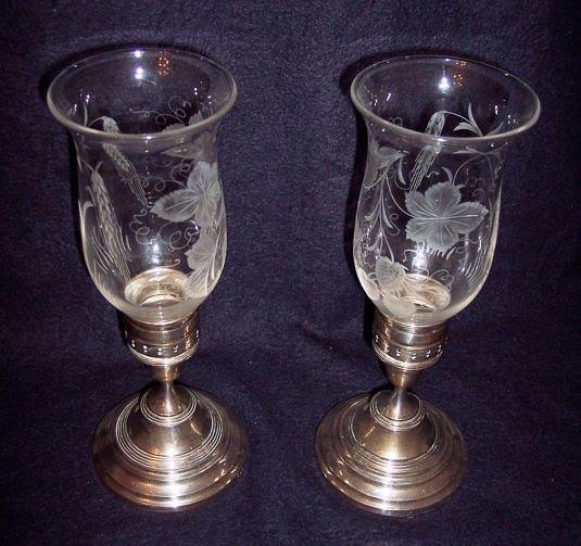 Appraisal: A pair of candle holders the glass shades engraved hops