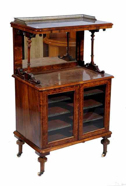 Appraisal: A VICTORIAN FIGURED WALNUT MUSIC CABINET with mirrored back and