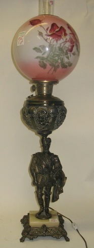 Appraisal: AN AMERICAN FIGURAL BANQUET LAMP having an ornate metal base