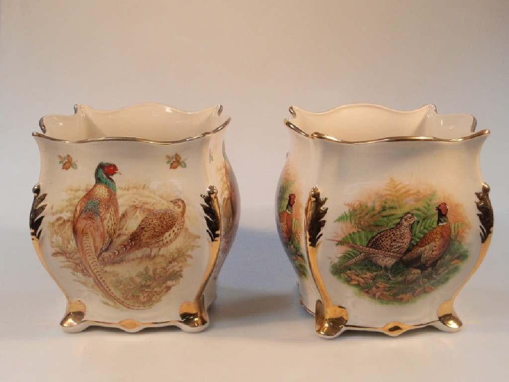 Appraisal: A pair of Staffordshire pottery Flora and Fauna jardiner s