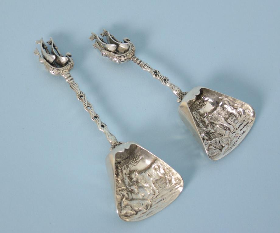 Appraisal: Two Dutch silver Sugar Scoops with animal decorated bowls and