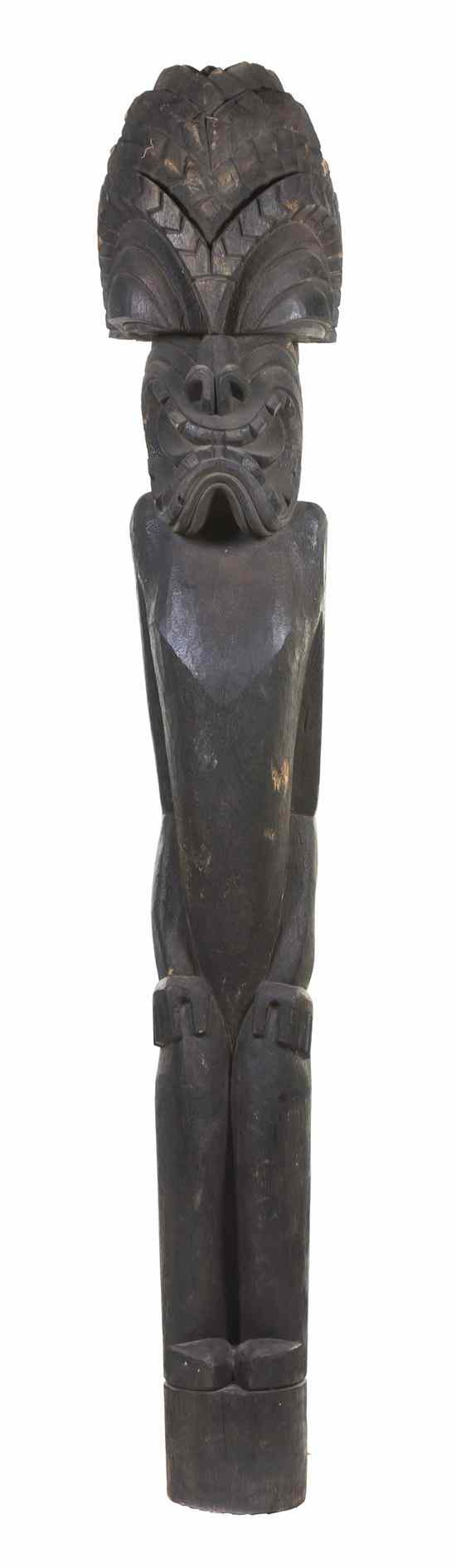 Appraisal: A Carved Wood Tiki depicting a crouching female with stylized