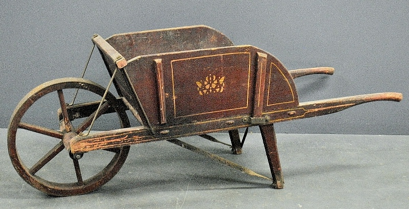 Appraisal: - Early wheelbarrow with original red paint decoration h x