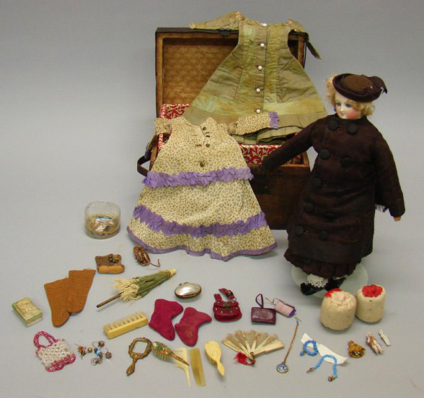 Appraisal: B French Fashion doll with trunk wardrobe and accessories Possibly