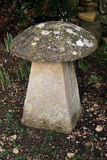 Appraisal: A staddle stone with circular top and a tapered base