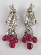 Appraisal: A pair of white metal tests platinum cabochon ruby and