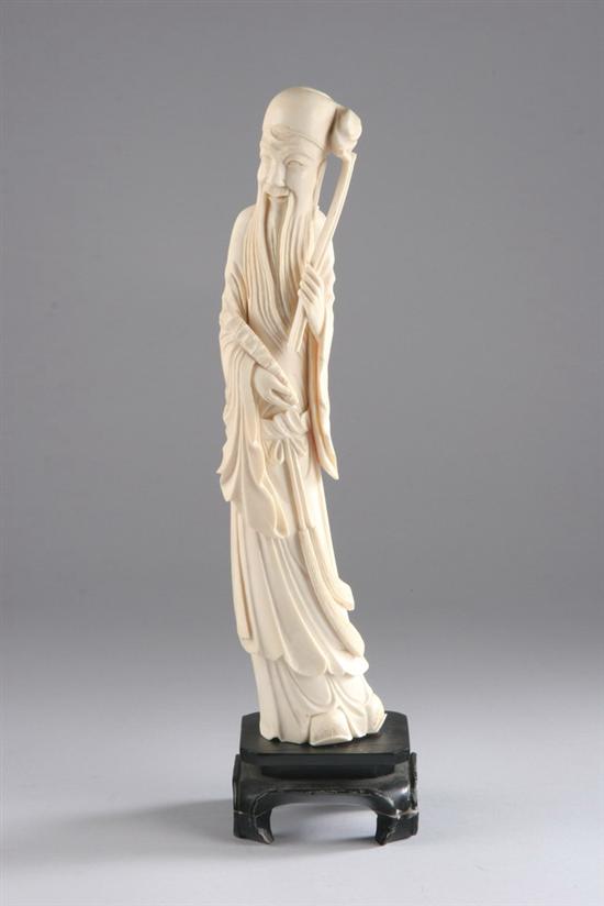 Appraisal: CHINESE IVORY FIGURE OF IMMORTAL th century Standing wearing beard