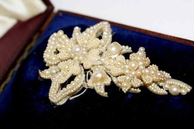 Appraisal: A VICTORIAN PEARL BROOCH in the form of a bow