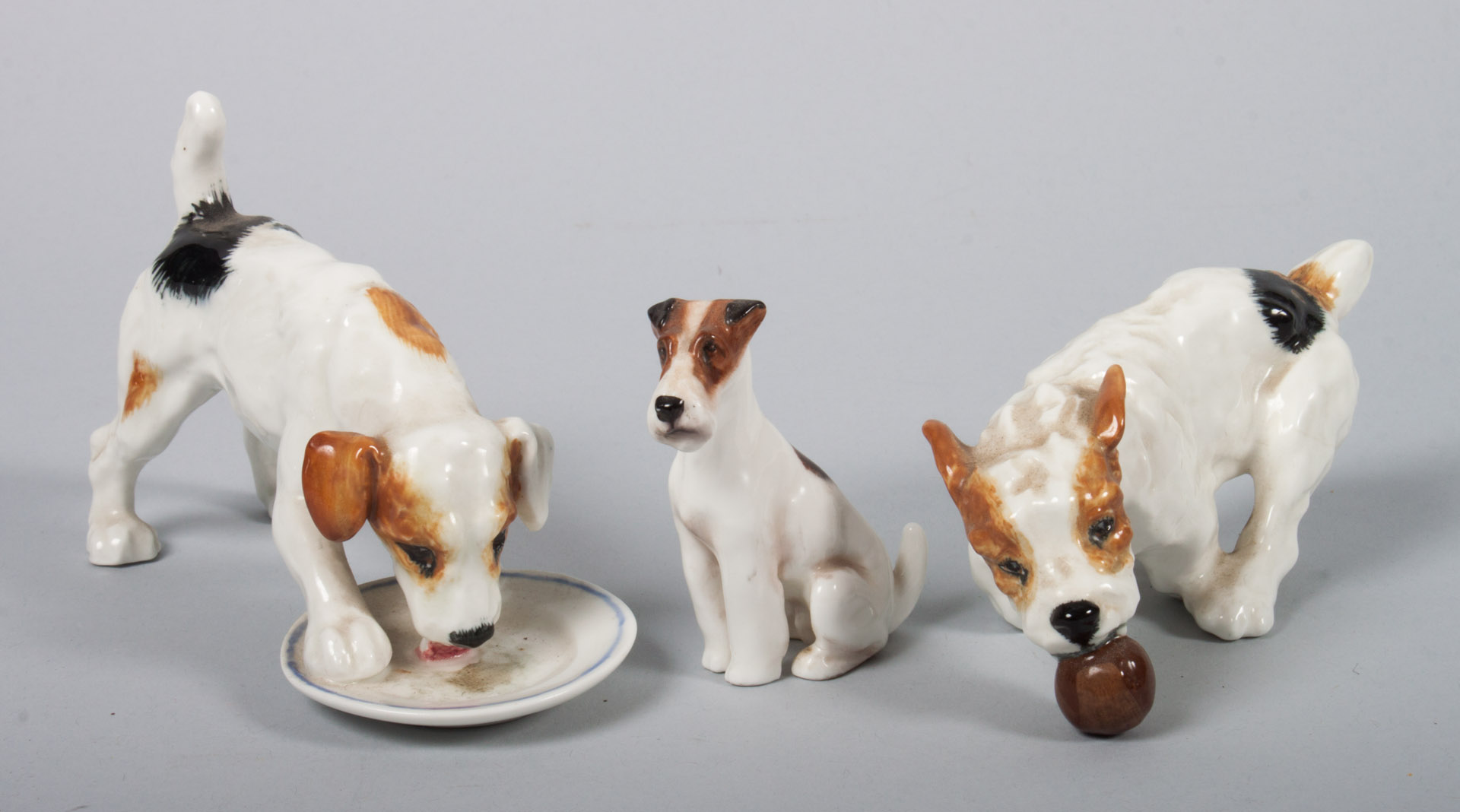 Appraisal: Three Royal Doulton china dogs Dog Eating off Plate H