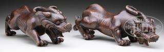 Appraisal: PAIR OF CROUCHING BRONZE TIGERS th century China Each tiger